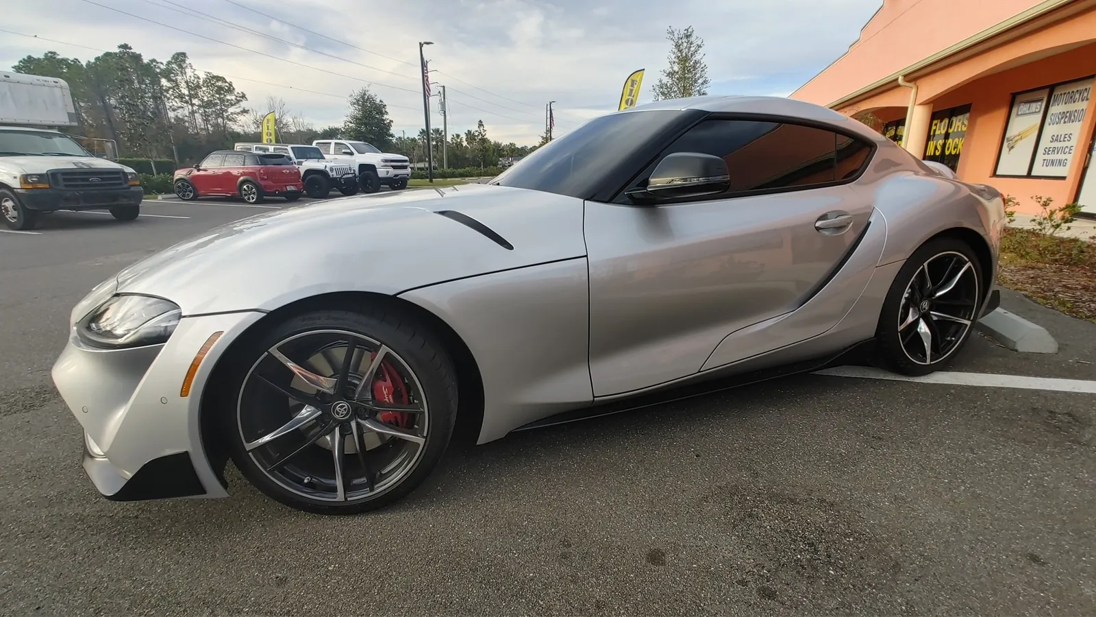 Silver Toyota Supra side three-quarter view