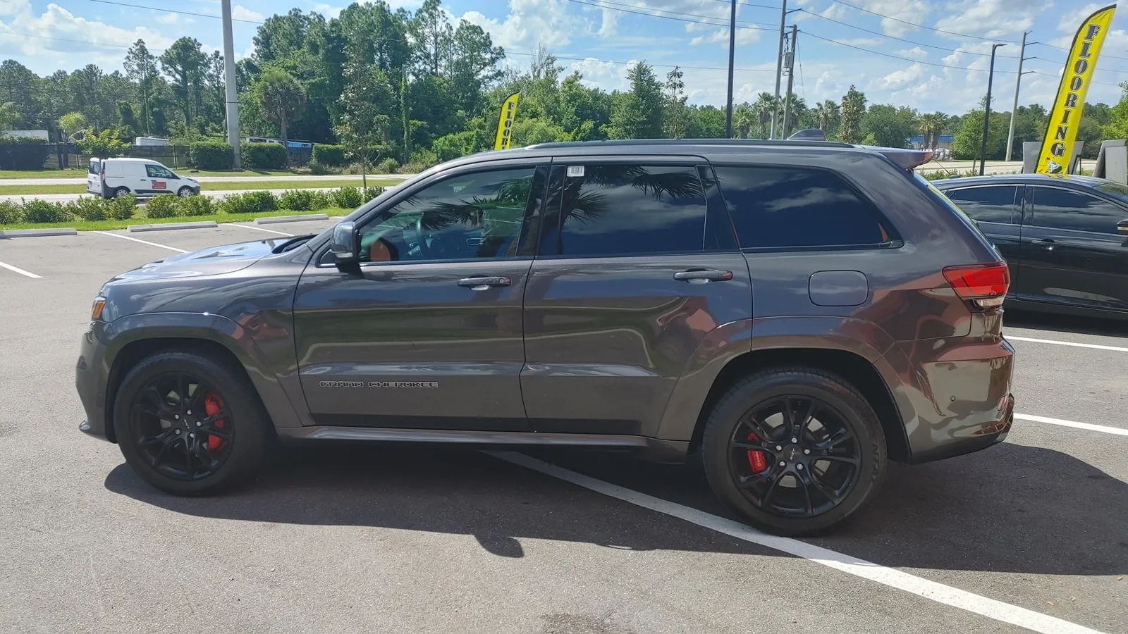 Gray Jeep Grand Cherokee SRT with tint