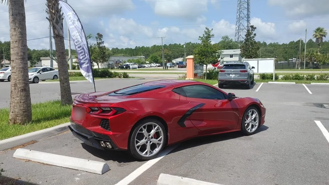 Red C8 Corvette rear three-quarter