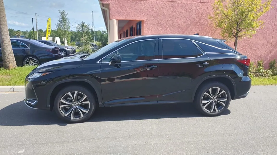 Black Lexus RX with tinted windows