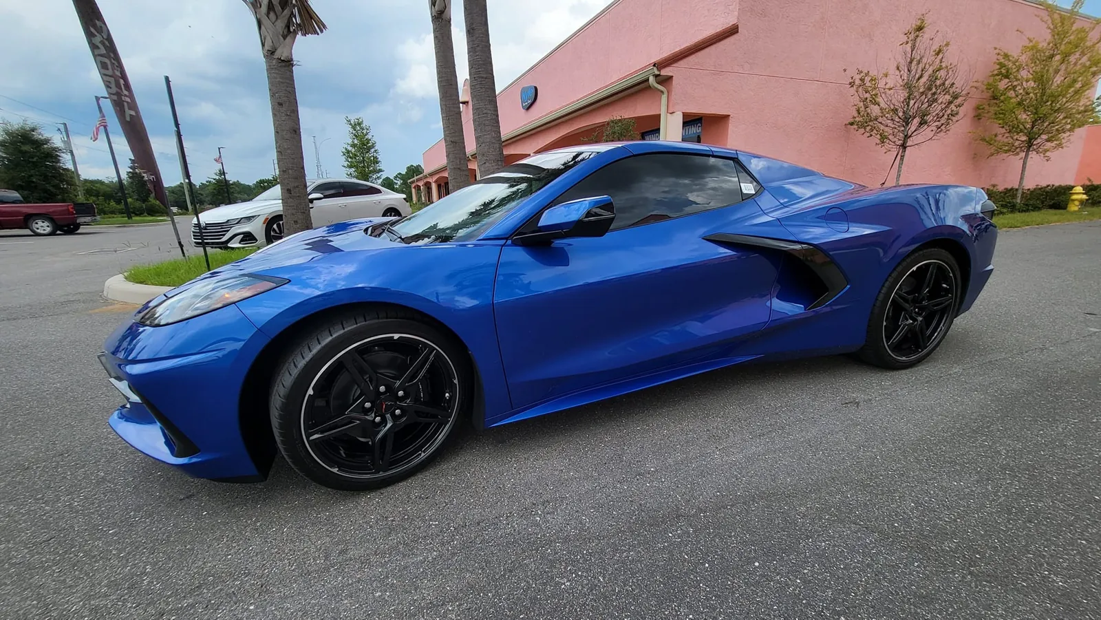 Blue C8 Corvette with tinted windows