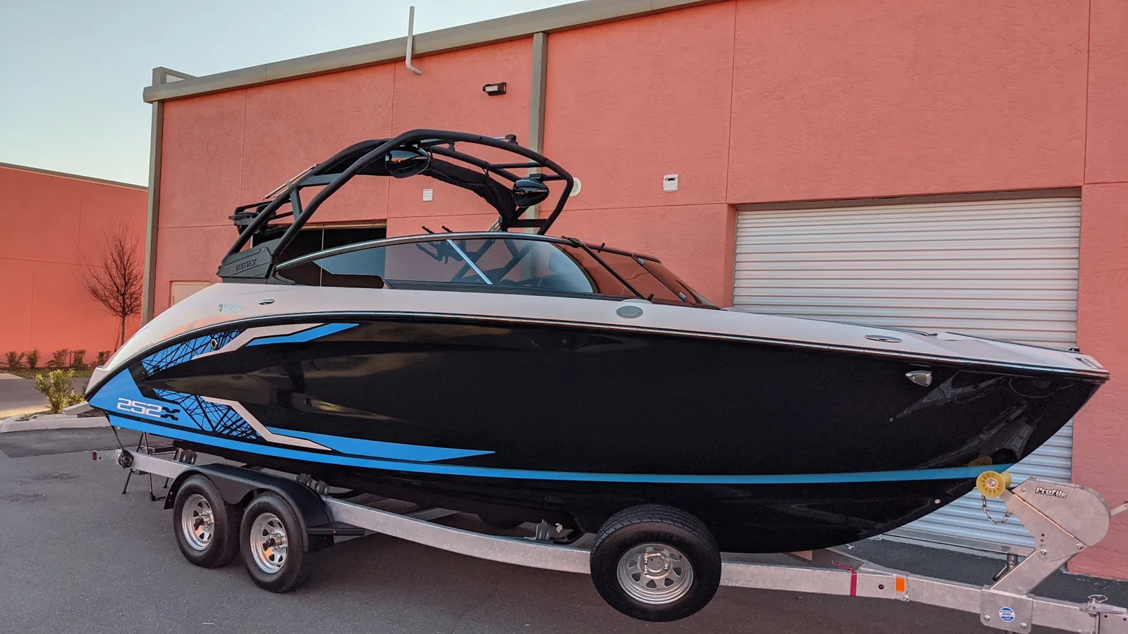 Wake boat with tinted windshield by Flagler Tint