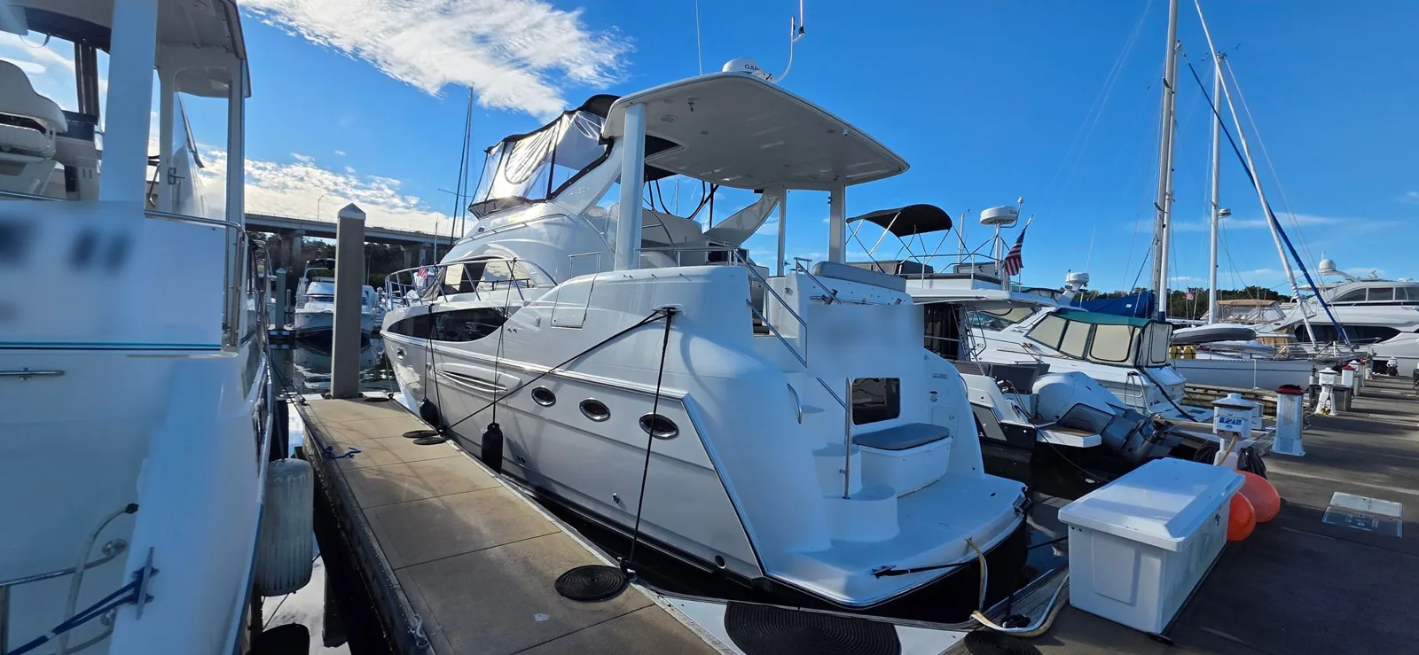 Motor yacht at a marina dock, Flagler Tint marine window tint